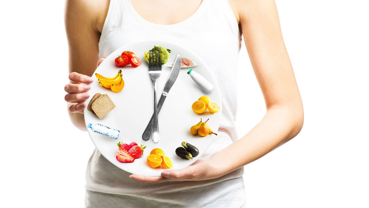Girl holding a plate of food